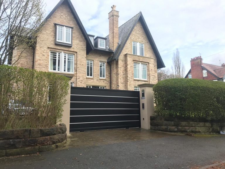 Dark Grey Aluminium Gates in a driveway